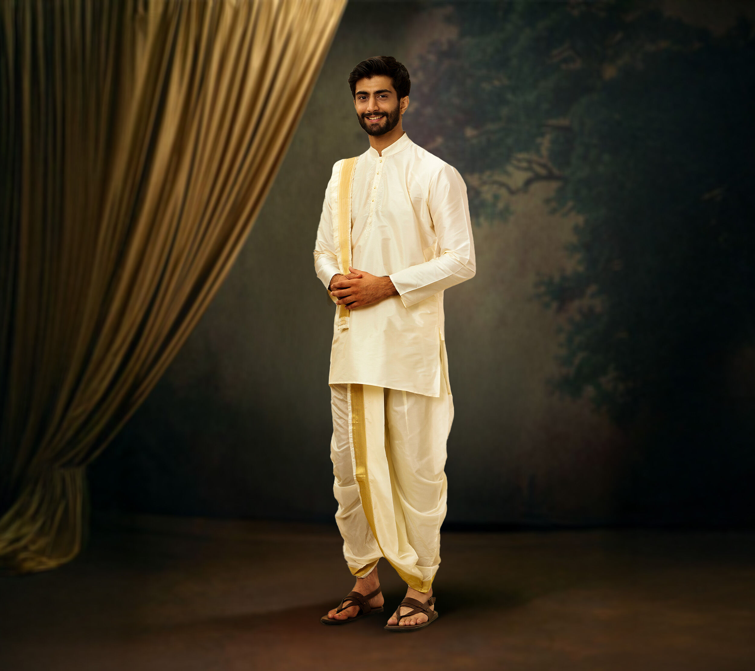 Man in ivory kurta and traditional mundu attire for Vishu celebration, styled in classic Kerala festive look